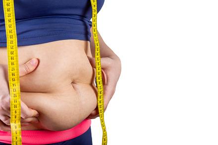 Overweight woman with measuring tape showing belly fat, horizontal, copy space,, a Health & Medical Photo by iuliia_n