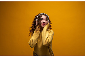 Young woman with curly hair, a Person Photo by volodymyrshtun13795