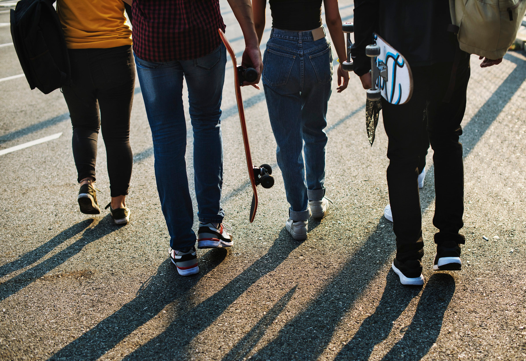 Group of school friends outdoors featuring adult, african american, and
