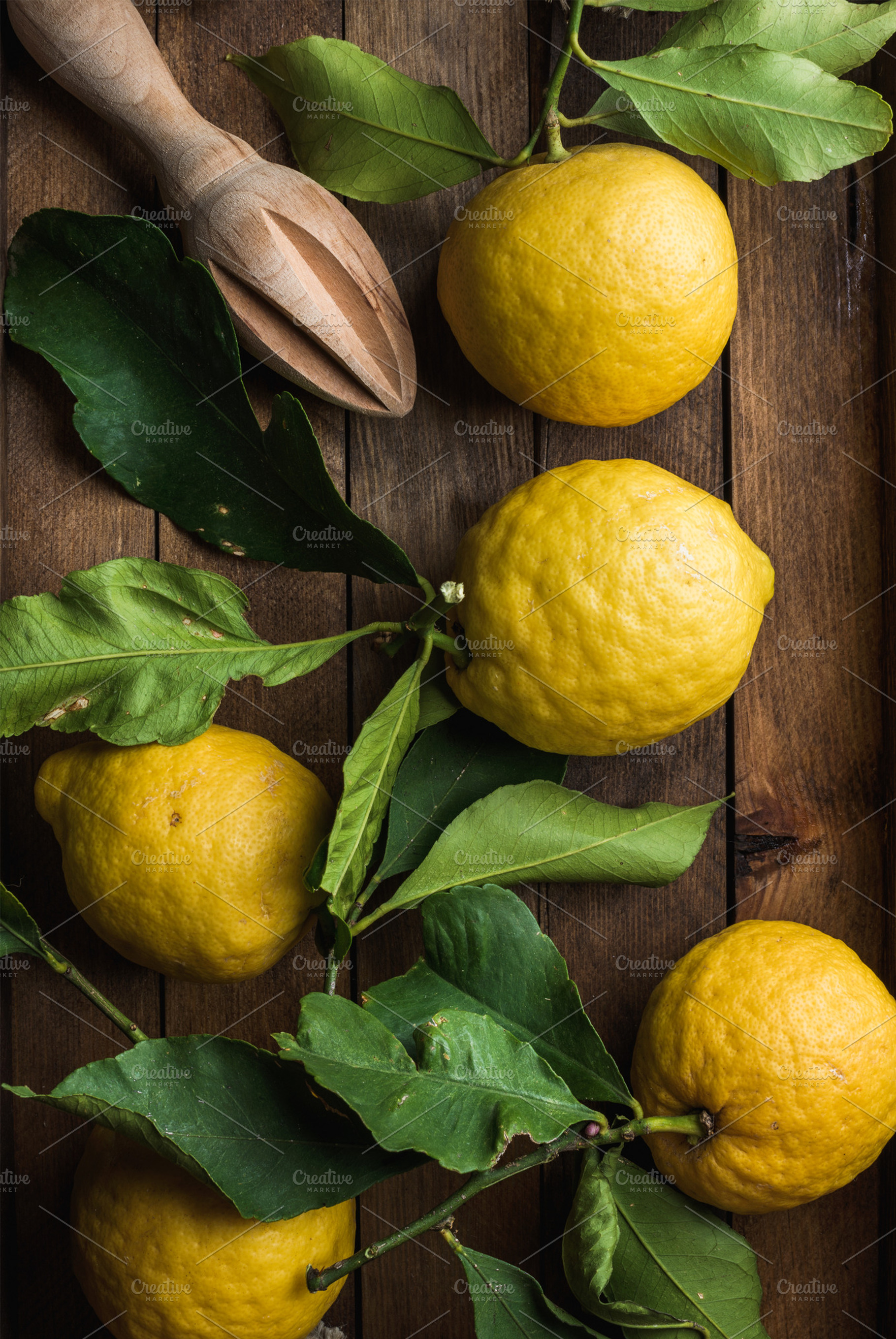 Fresh lemons with leaves featuring lemon, yellow, and citrus, a Food & Drink Photo by Foxys