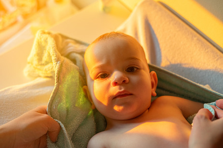 Portrait of a nine month old baby after bath time