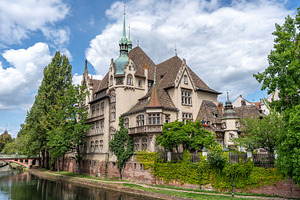 Historic building with ornate gate in Strasbourg, an Architecture Photo by GoodGoods