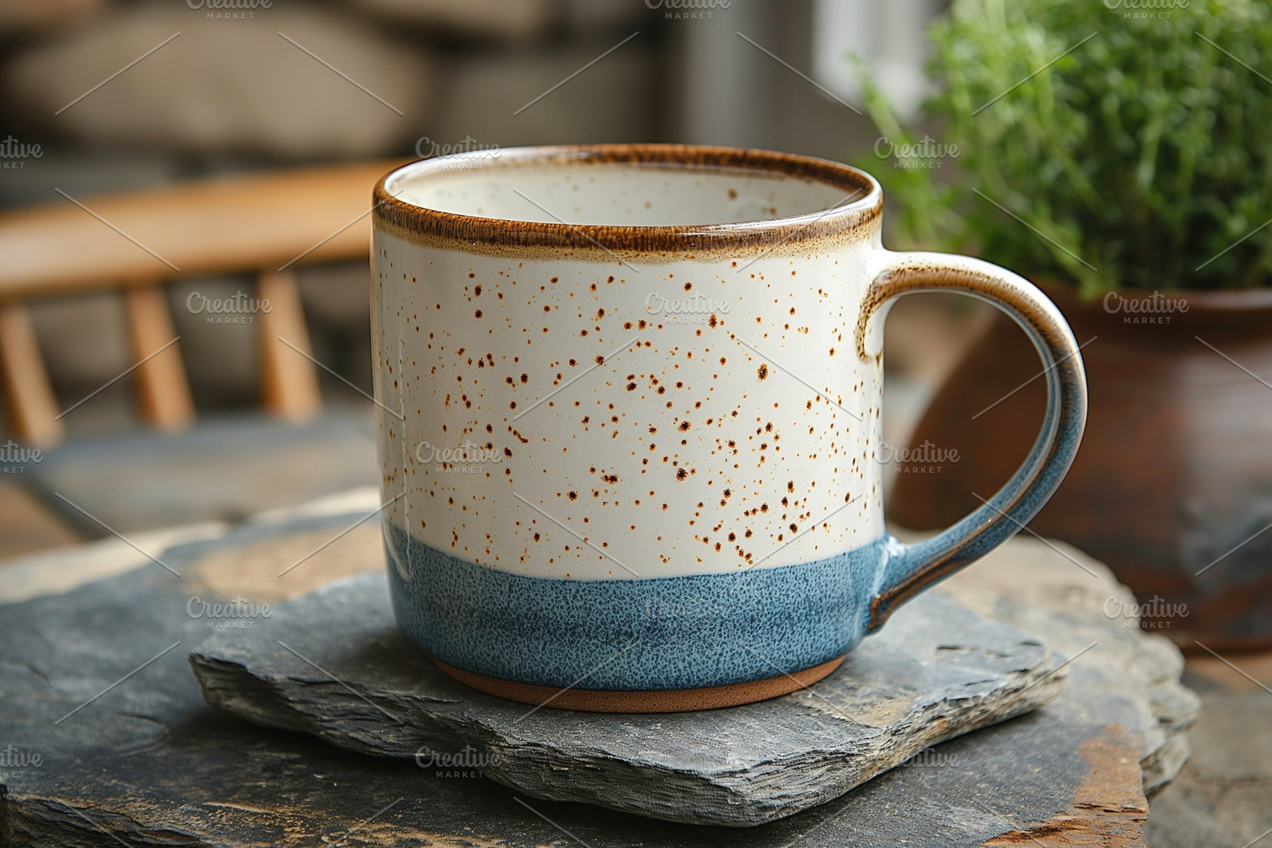 A rustic ceramic mug with a speckled design, resting on a slate stone, surround, a Business Photo by ImageMir