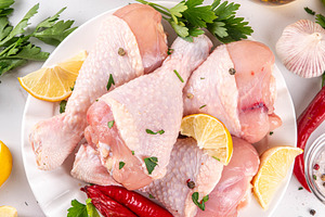 Fresh raw organic chicken legs, drumsticks, with spices and cond, a Food & Drink Photo by Rimma