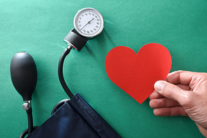 Blood pressure health concept with hand with heart and tensiomet, a Health & Medical Photo by Davizro's Market