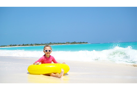 Adorable little girl with inflatable, a Person Photo by travnikovstudio