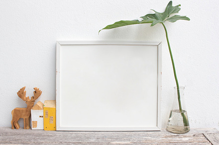 Blank frame poster on wall containing frame, mockup, and wall, a Business Photo by ptystockphoto