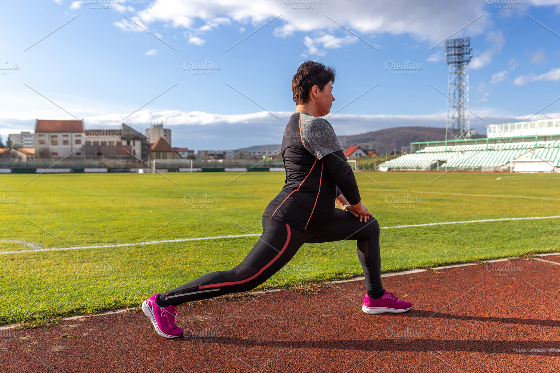 Woman stretching in lunge, a Photo by Grafvision photography