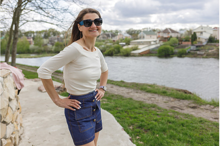 Young woman in short denim skirt and, a Person Photo by serkum
