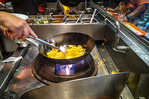 Cooking french fries at street food market, a Food & Drink Photo by DanFLCreativo