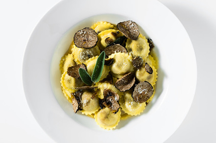 Italian ravioli with butter, parmesan cheese and truffle on the