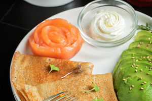 Roasted thin pancakes with smoked salmon and sauce, a Food & Drink Photo by Budarinphoto