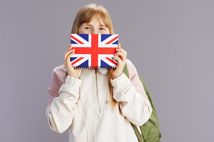 modern pupil in beige tracksuit with backpack, a School & Education Photo by Alliance Images