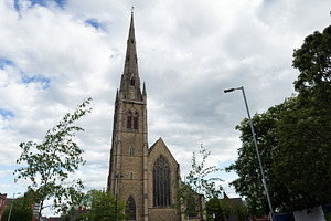 Gothic St Mary, Hulme church with tall spire and stone façade i