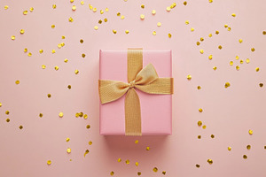 Gift box with gold confetti, a Photo by Beautiful things