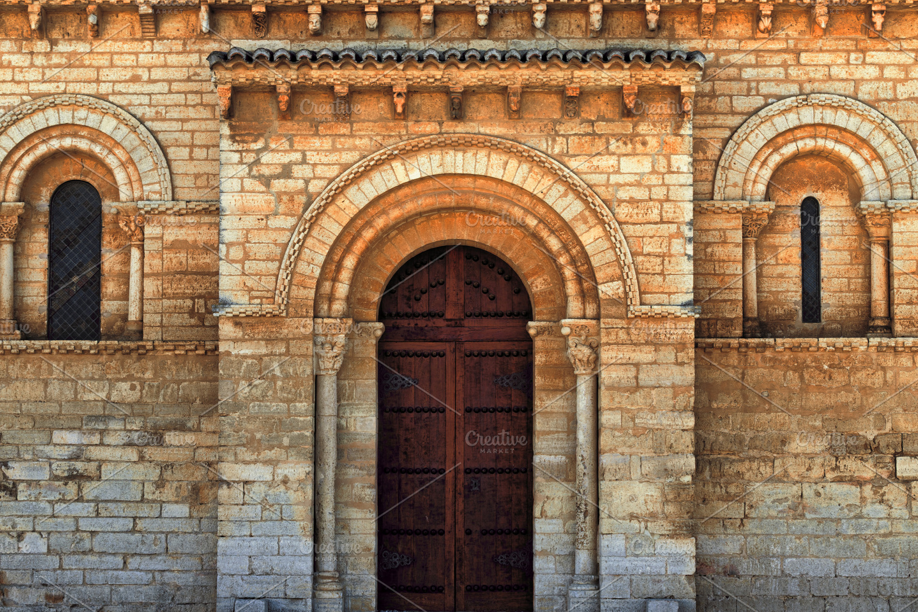 Romanesque door of a medieval church, an Architecture Photo by Perpis