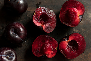 Ripe plum on a rusty background