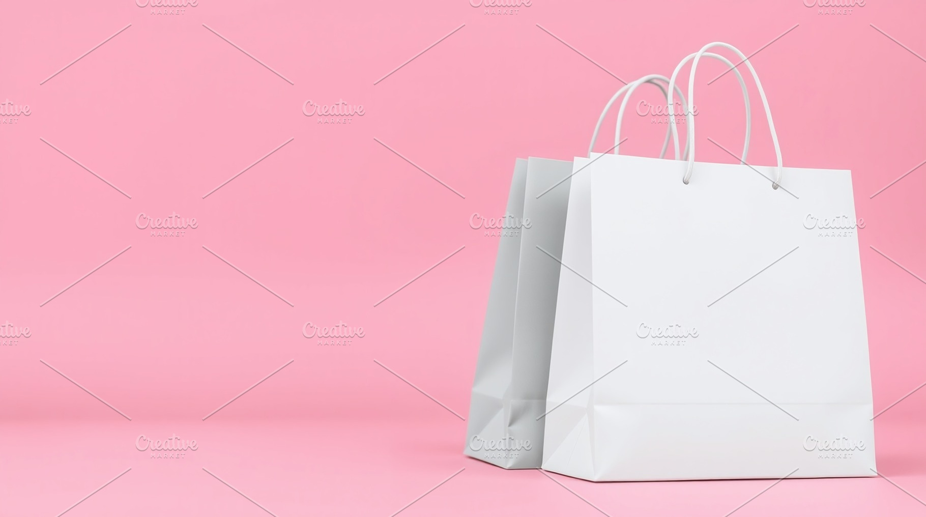 White shopping paper bags on pink, a Photo by Bunny's Little Shop