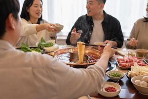 Hot pot party with friends enjoying, a Photo by Dvoevnore photos