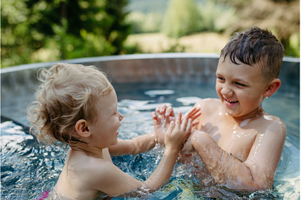 Siblings playing in the water, a Sports & Recreation Photo by HalfPoint