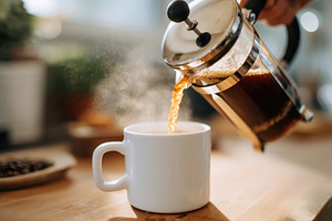 Pouring coffee into a mug, a Food & Drink Photo by AlyaAnd