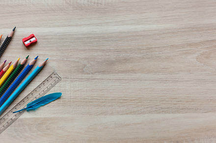 Wooden Desk with Colored Pencils, a School & Education Photo by RSQB