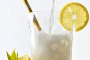 Filling glass with lemon soda decorated with straw and lemon, a Food & Drink Photo by Davizro's Market (Thumbnail 1 of 2)