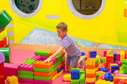 boy playing with building toy blocks