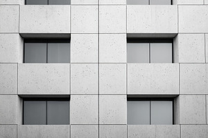 Modern concrete building facade with windows, an Architecture Photo by AlyaAnd