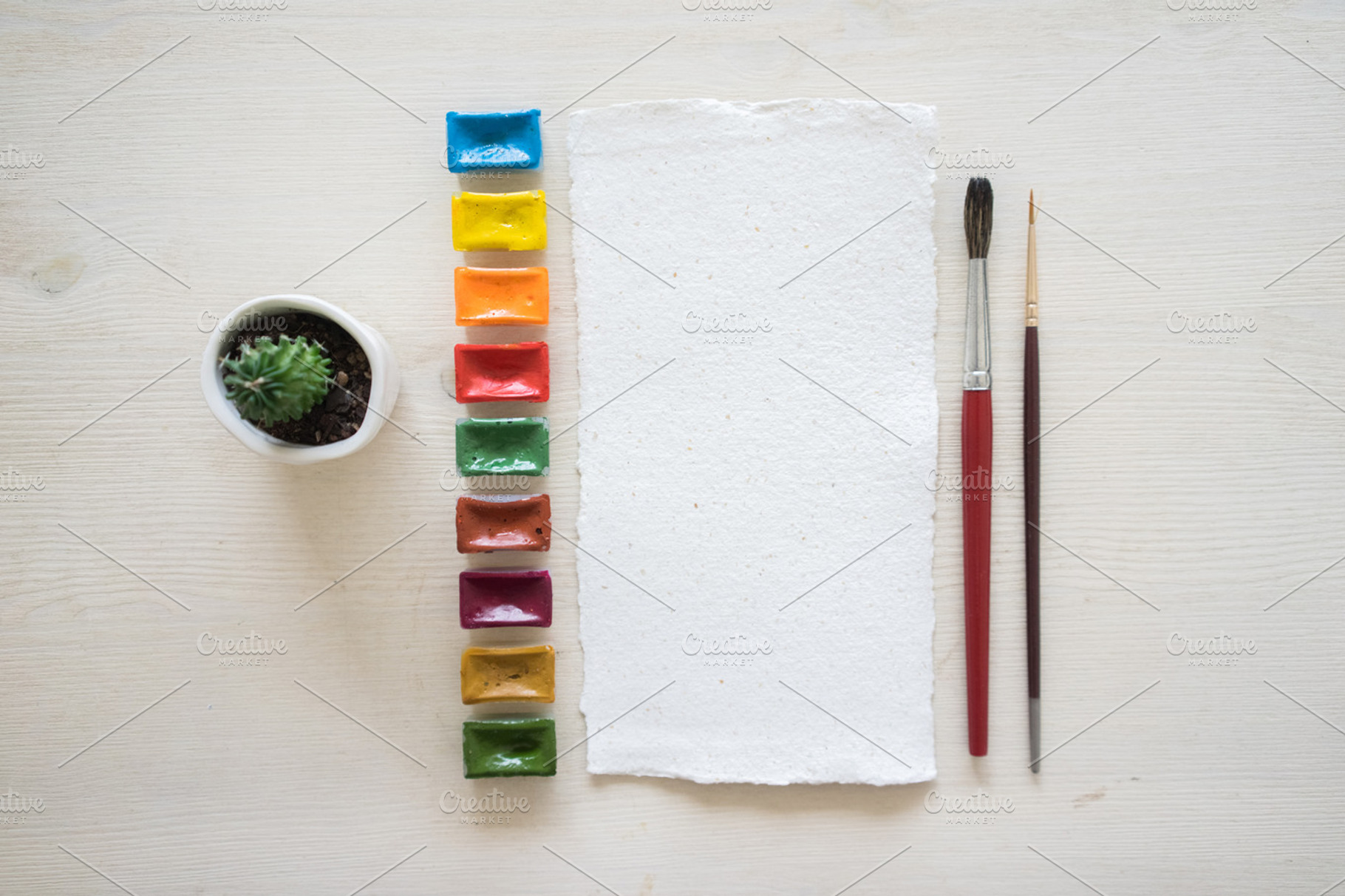 Paper and watercolor pack containing pastel shades, table, and paper, an Arts & Entertainment Photo by Julia Brenner