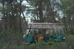Hippie old van abandoned in forest stock photo containing banner and blue