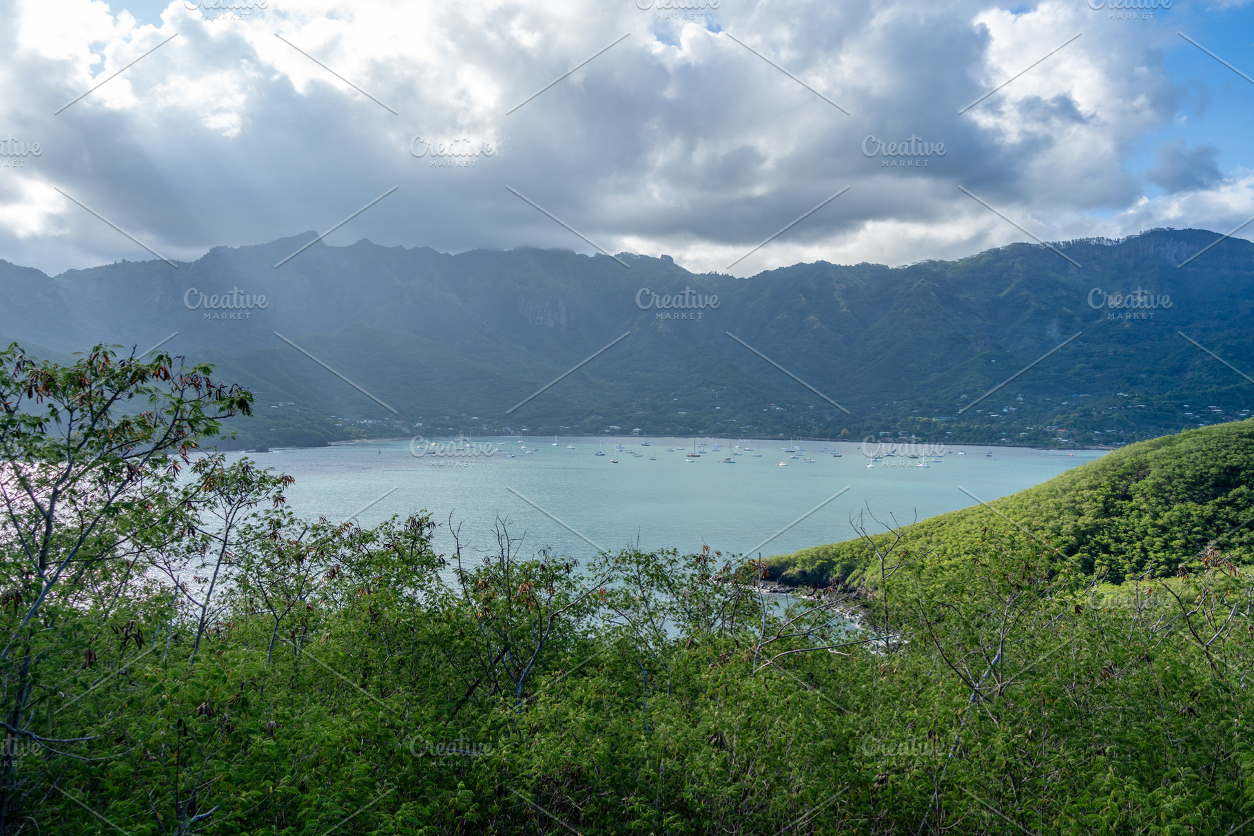 Taiohae Bay and town with anchored sailboats in Nuku Hiva, Marqu, a Nature Photo by GoodGoods