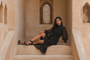 Woman sitting in a historic building, a Photo by Beautiful things