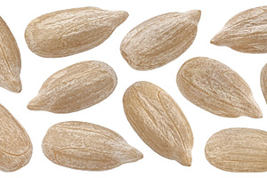 Peeled sunflower seeds isolated, a Food & Drink Photo by Max Lashcheuski