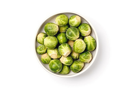 Bowl fresh brussels sprouts top view, a Food & Drink Photo by Ylivdesign