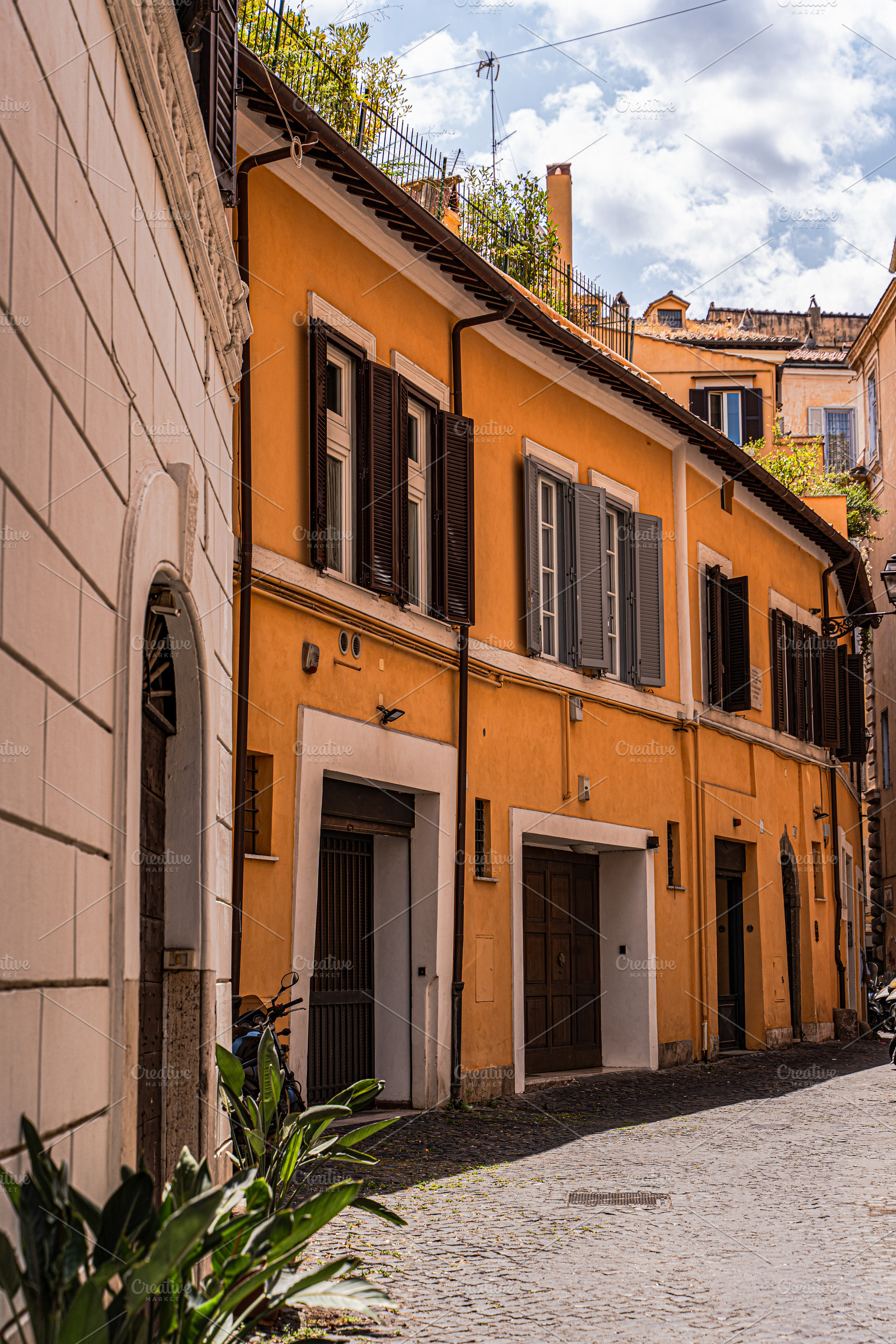 Medieval narrow street in the heart of Rome, Italy, an Architecture Photo by Anna Bogush
