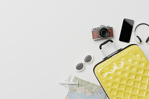 Travel accessories with suitcase on minimal white background, a Holiday Photo by RF Images