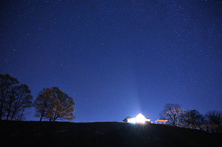 Night sky over over lonely house