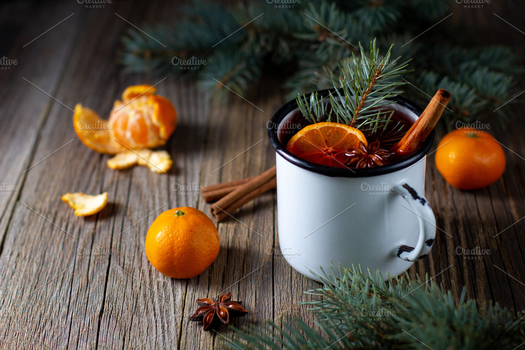 Traditional tasty mulled wine hot drink with mandarin apple spices and christma, a Food & Drink Photo by dashtik
