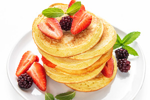 Pancakes stacking with strawberries, blackberries, and mint, a Food & Drink Photo by Olena Rudo