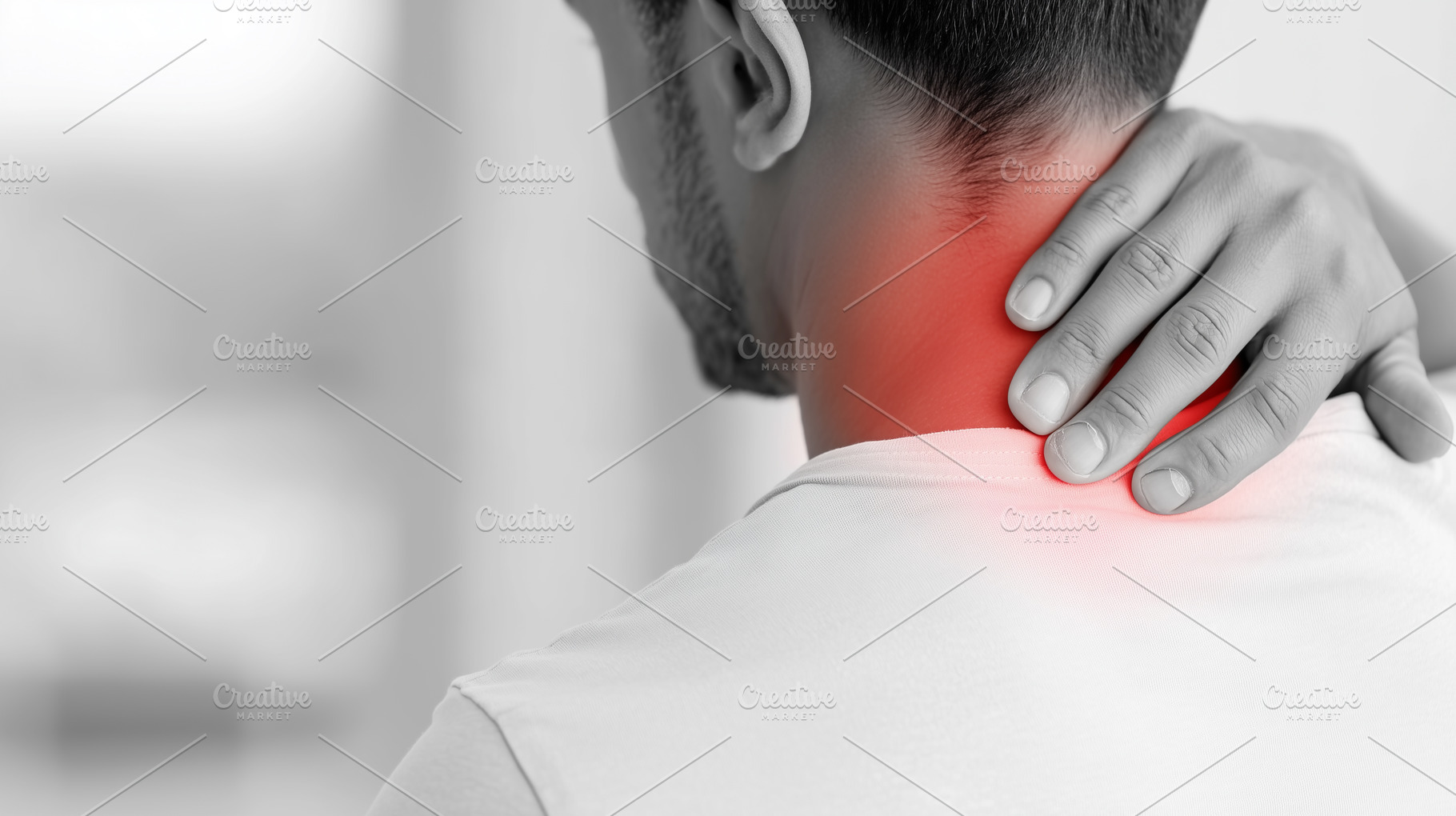 Man suffering from neck pain holding, a Health & Medical Photo by MistyDay