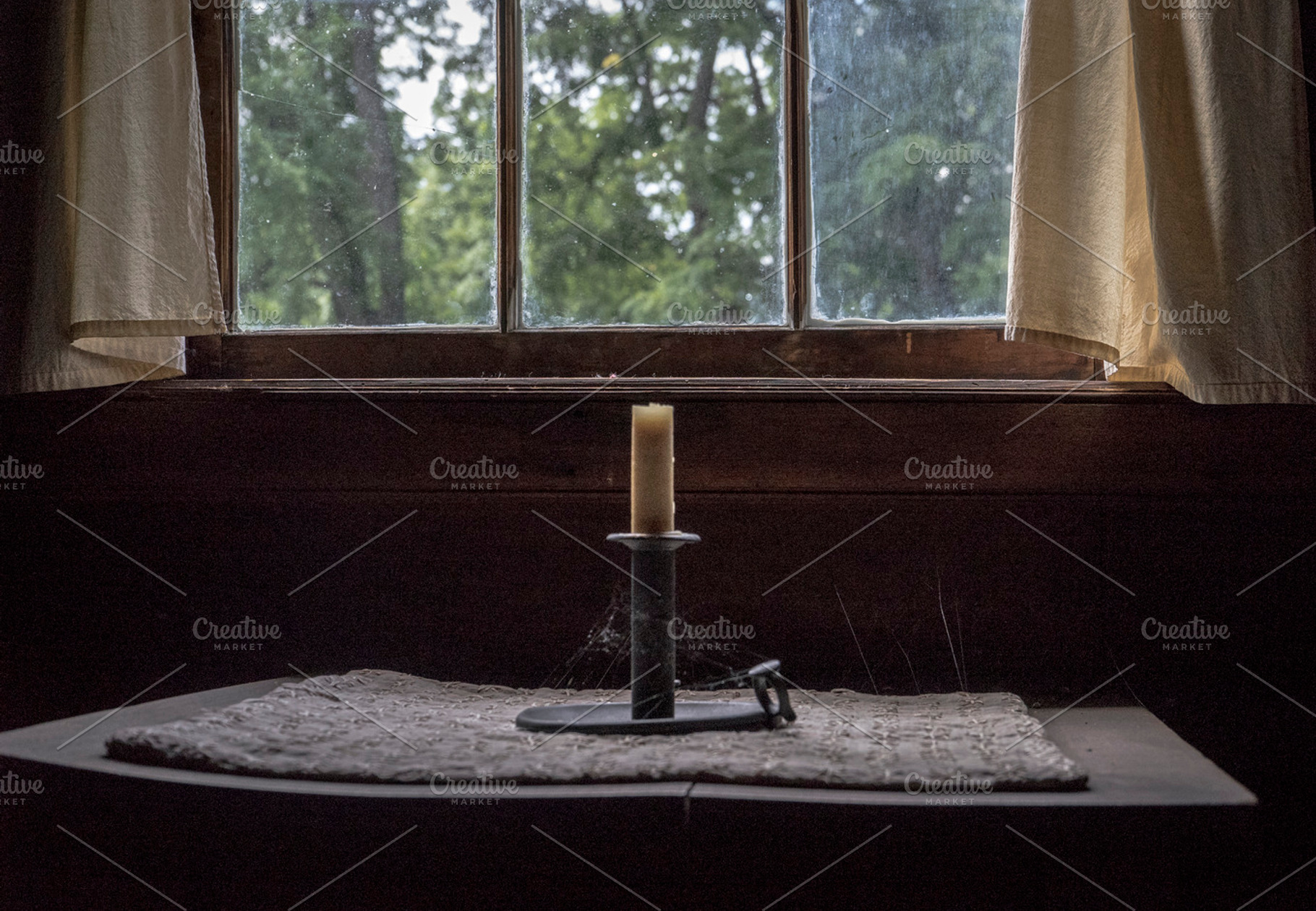 Old Candle in Cabin Window, an Architecture Photo by Crux Creative