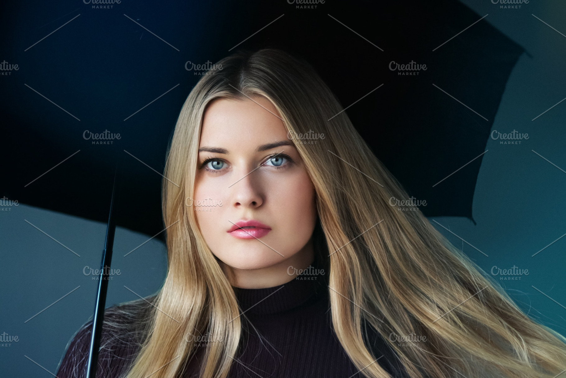 Young woman with blonde hair holding an umbrella, looking at cam, a Person Photo by Studio ANNA