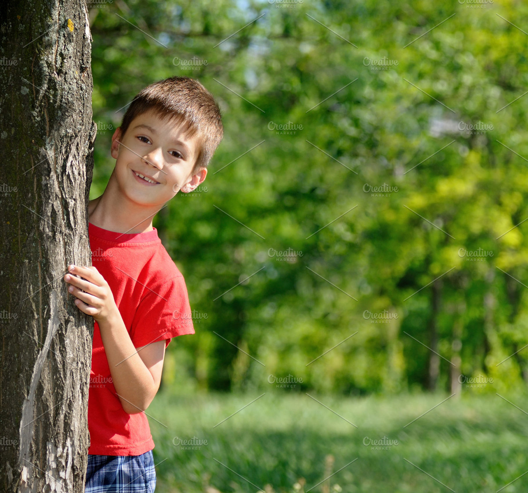 Boy standing near the tree