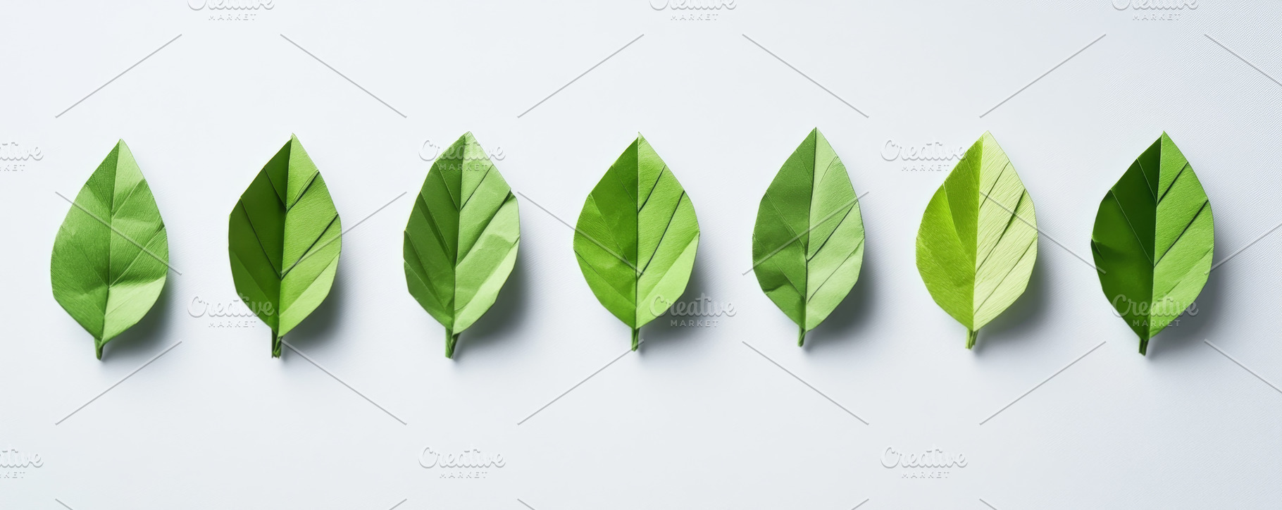 Green paper origami leaves arranged in a row banner, an Abstract Photo by Natalia Klenova's Shop