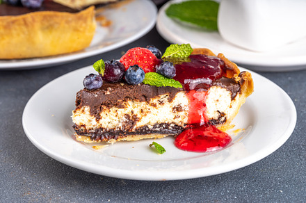 Homemade cheesecake with chocolate and berry, a Food & Drink Photo by Rimma