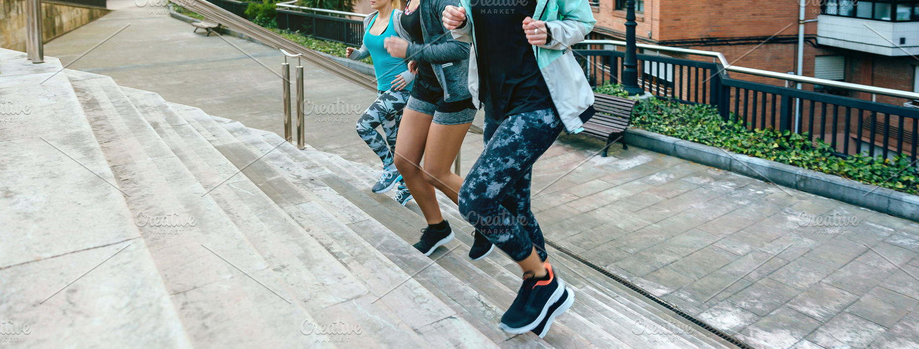 Young women friends training running up stairs in town, a Sports & Recreation Photo by davidpereiras