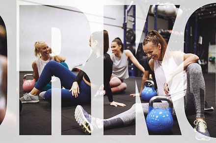 Fit women laughing together after a gym workout