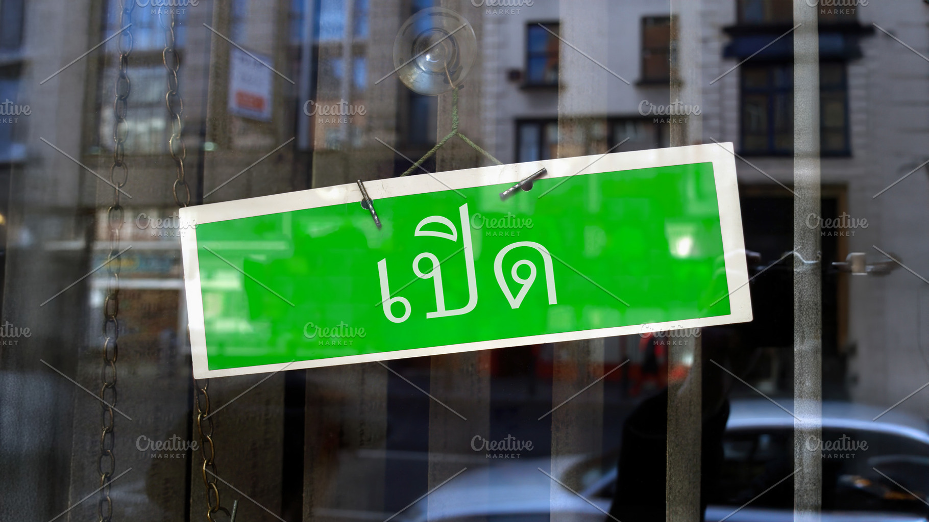 open sign in Thai, a Photo by WorldOfPhotos