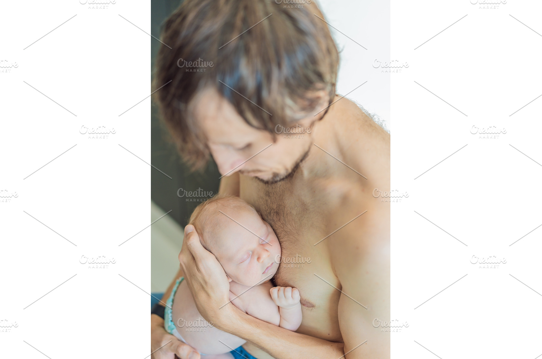 Father cuddling his sleeping newborn, a Person Photo by Elizaveta Galitskaya